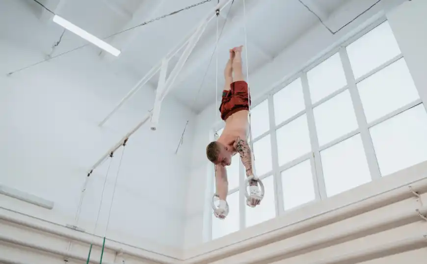 Gymnast Inverted on Rings