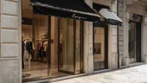 Exterior view of boutique store front with black canopy